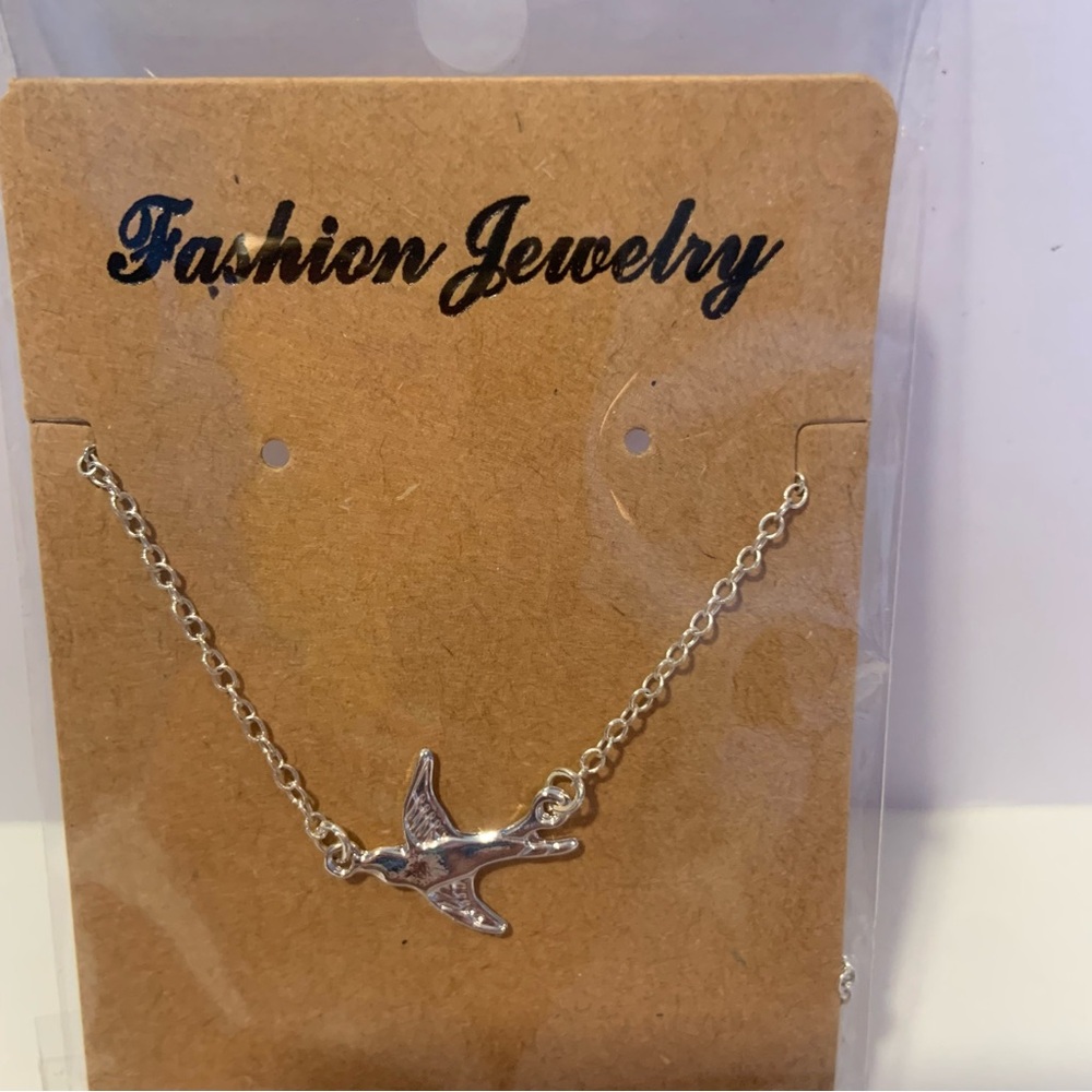 Flying Bird silvertone necklace, NEW